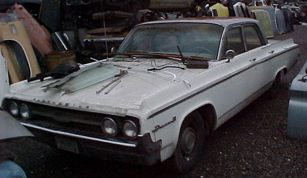 1964 Olds Dynamic 88 4 dr sedan, 425 2 barrel, power steering and brakes, straight, not rusty, complete, original and untouched, but engine is seized $1,500  n-289